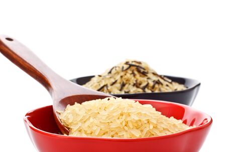 two bowls with rice and wooden spoonの写真素材