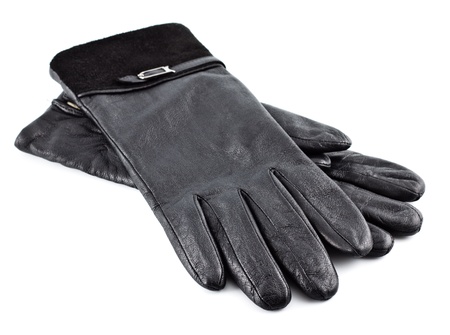 pair of black female's leather gloves isolated on whiteの写真素材