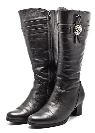 black leather female boots isolated on whiteの写真素材