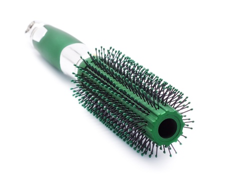 green hair brush isolated on white backgroundの写真素材