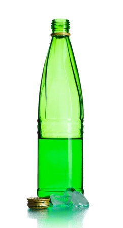 green soda bottle and ice cubes, white backgroundの写真素材