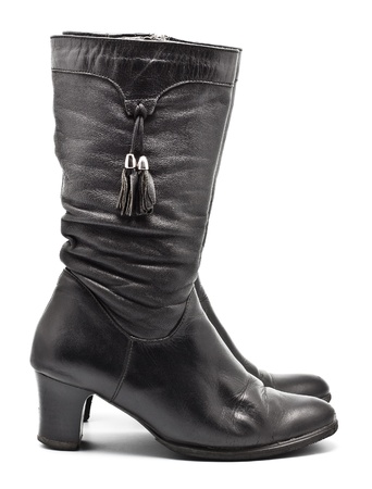 black leather female boots isolated on whiteの写真素材