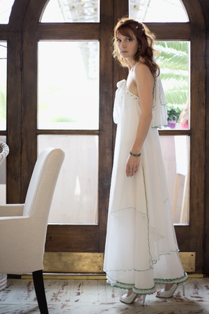 beautiful woman in white wedding dress at interiorの写真素材