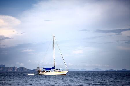 white yacht at anchor, Andaman Sea, Thailandの写真素材