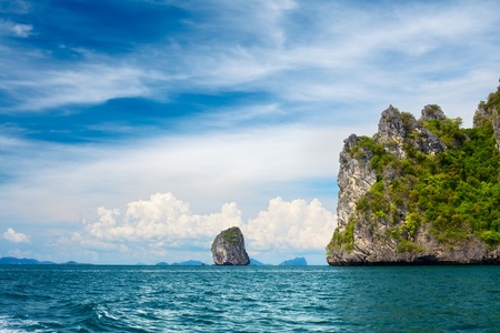 tall cliff with trees at Andaman Sea, Thailandの写真素材
