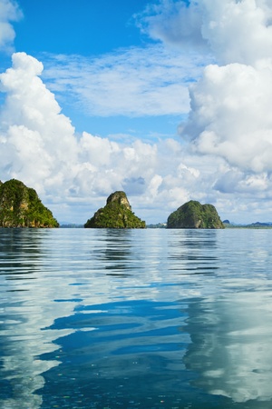tall cliffs with trees at Andaman Sea, Thailandの写真素材