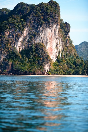 tall cliff with trees at Andaman Sea, Thailandの写真素材