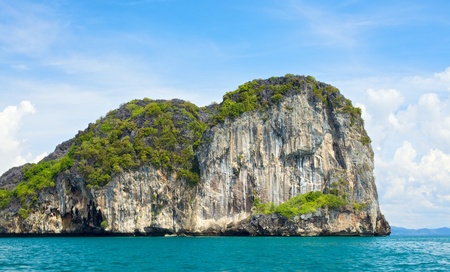 tall cliff with trees at Andaman Sea, Thailandの写真素材