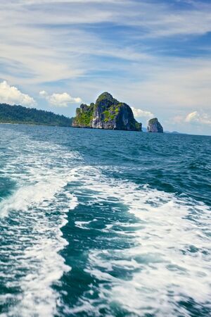 tall cliff with trees at Andaman Sea, Thailandの写真素材