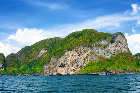 tall cliff with trees at Andaman Sea, Thailandの写真素材