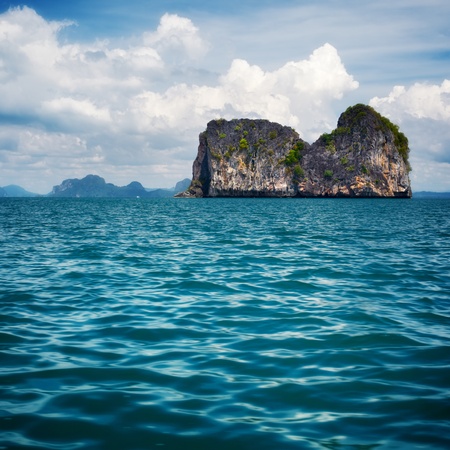 tall cliff with trees at Andaman Sea, Thailandの写真素材
