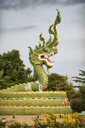 green water dragon statue in Krabi, Thailandの写真素材