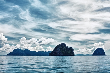 tall cliff with trees at Andaman Sea, Thailandの写真素材