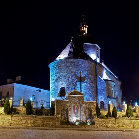 Trinity Church in Kamianets-Podilskyi, Ukraine, at nightの写真素材