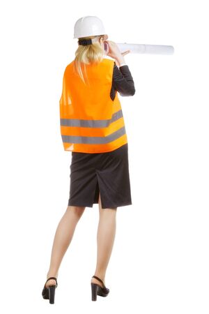 engineer woman looking from drawing tube like looking glassの写真素材