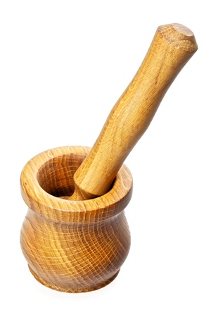 wooden pestle and mortar isolated on whiteの写真素材