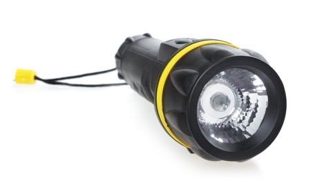 black electric pocket flashlight, isolated on white