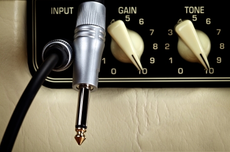 retro guitar amplifier control panel, close up