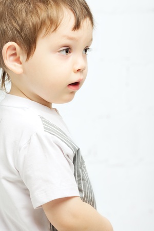 beautiful serious boy with brown eyes portraitの写真素材