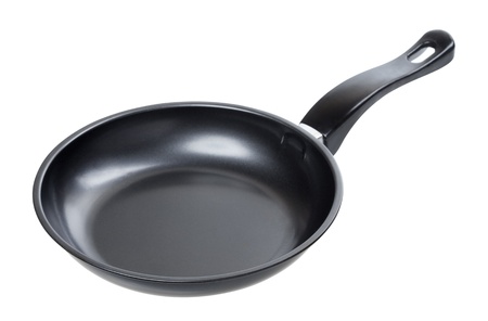 black frying pan isolated on white backgroundの写真素材