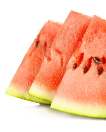 fresh slices of watermelon isolated on whiteの写真素材