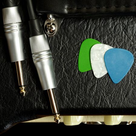 guitar amplifier with cable jack and plectrums, closeupの写真素材