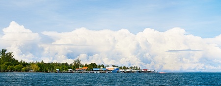 landscape with sea, sky and village, Asia, Thailandの写真素材