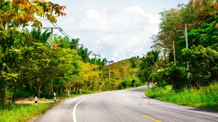 asphalt highway in jungle wit mount, Krabi, Thailandの写真素材