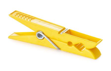 plastic yellow clothespin, isolated on white の写真素材