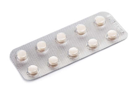 tablet pills in blister, isolated on whiteの写真素材