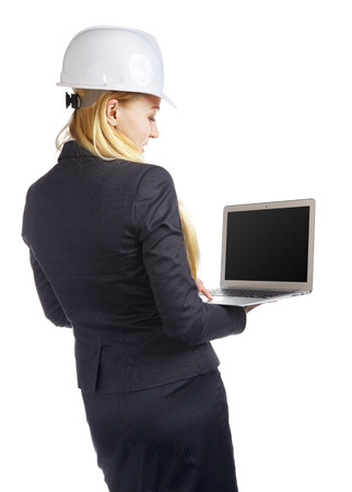 engineer woman with laptop, isolated on white, rear viewの写真素材