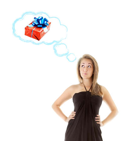 beautiful girl dreaming of gift, isolated on whiteの写真素材