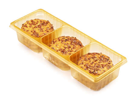 fresh sesame cookies in plastic pack, isolated on whiteの写真素材