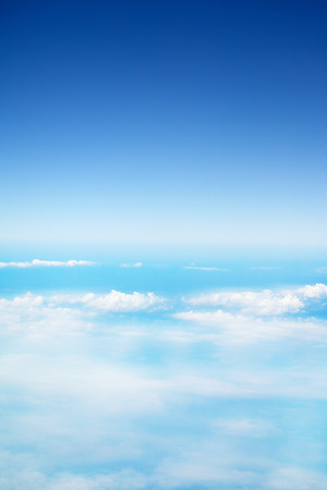 clouds in a blue sky, view from airplaneの写真素材