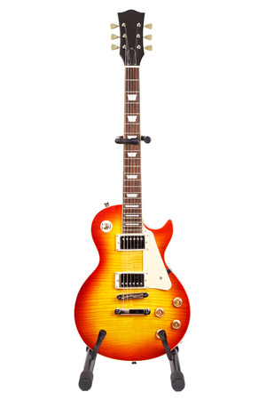 sunburst electric guitar on stand, isolated on white backgroundの写真素材