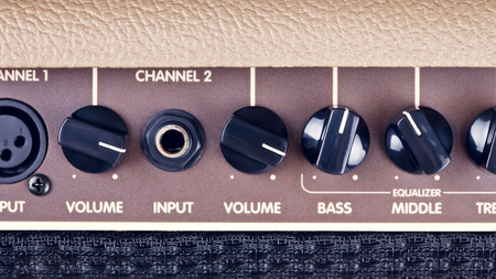 retro guitar amplifier control panel with knobsの写真素材