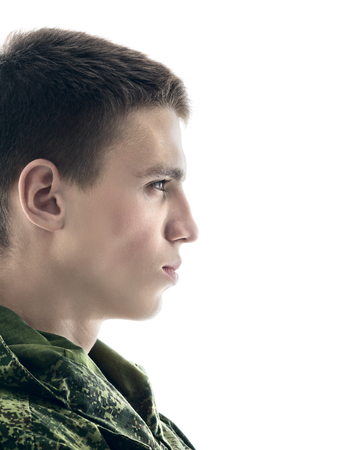 young military man profile, closeup portrait isolated on whiteの写真素材