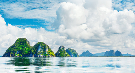 tall cliff with trees at Andaman Sea, Thailandの写真素材