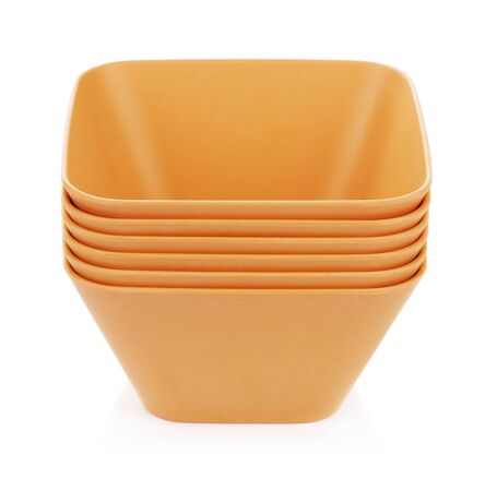 set of orange bamboo bowls, isolated on whiteの写真素材