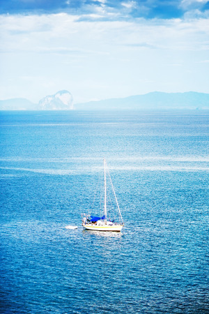 sailing white yacht in Andaman Sea, Thailandの写真素材
