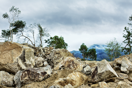 rocks in jungle under stormy sky, Thailandの写真素材