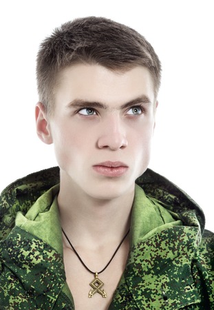 young military man, closeup portrait isolated on whiteの写真素材