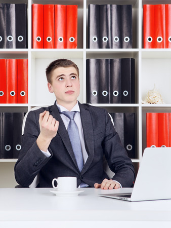 young businessman with laptop in his officeの写真素材