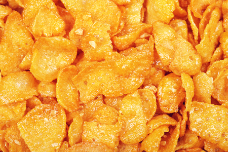 cornflakes with honey and nuts, closeup background