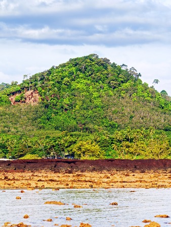 rocky beach at low tide, Andaman Shore, Thailandの写真素材