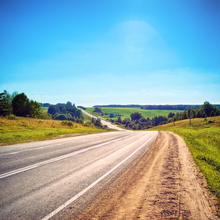 highway under clean blue sky at sunny day