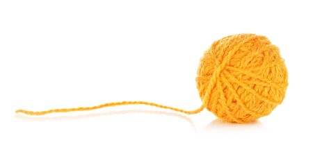 orange yarn ball, isolated on white backgroundの写真素材