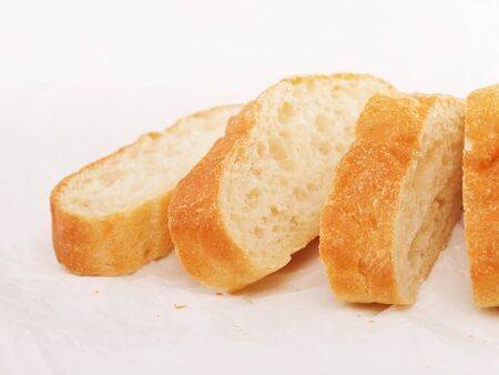fresh sliced ciabatta bread lying on tableの写真素材