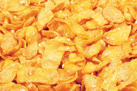 cornflakes with honey and nuts, closeup backgroundの写真素材