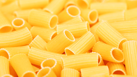 colorful raw pipe pasta background, close upの写真素材